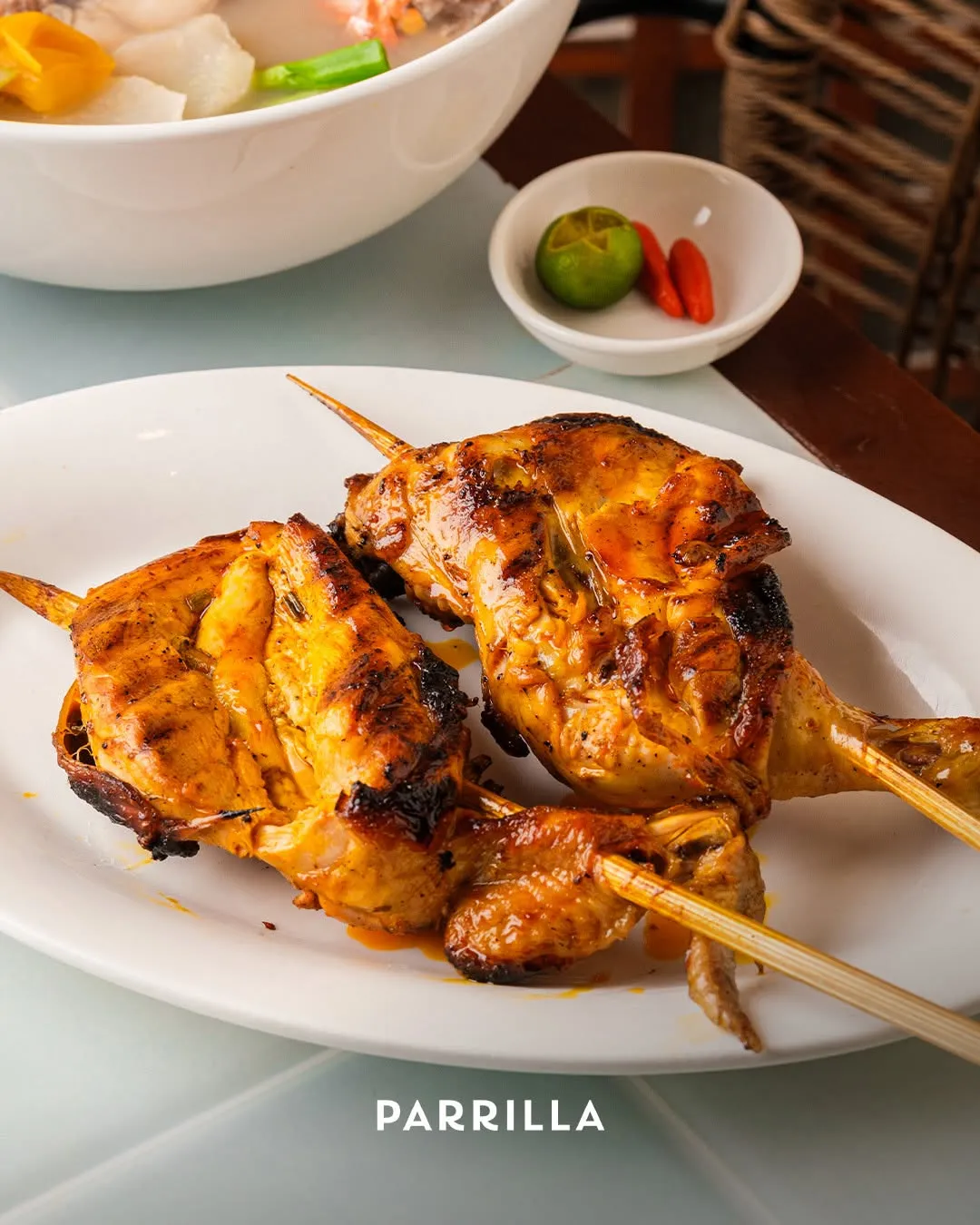 Chicken inasal, charred and glossy off the grill
